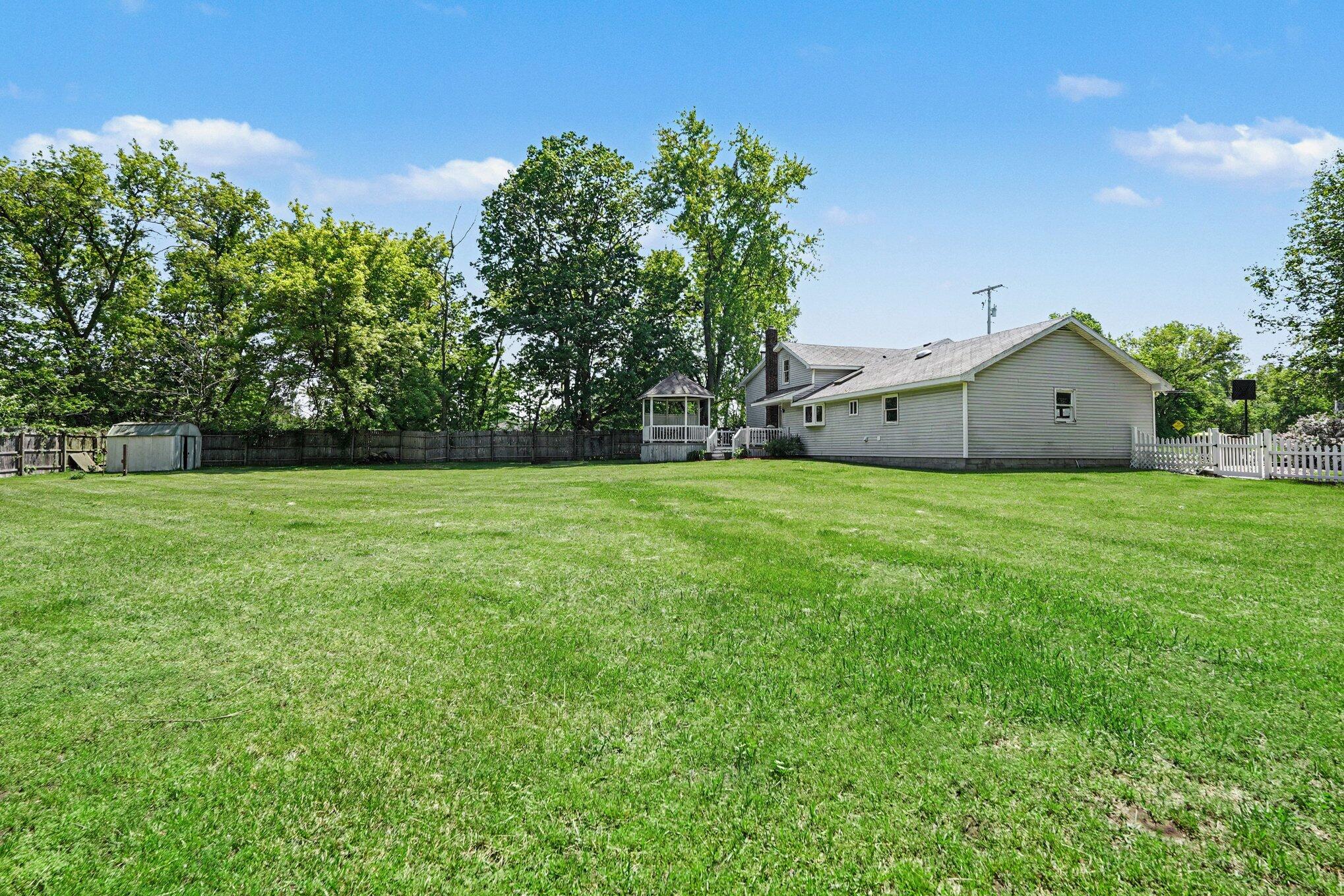 1721 Indian Lakes Road Northwest Kent City, MI 49330 - Photo 22 of 22 Backyard