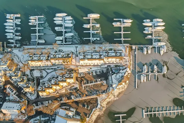 an aerial view of a house with a ocean view