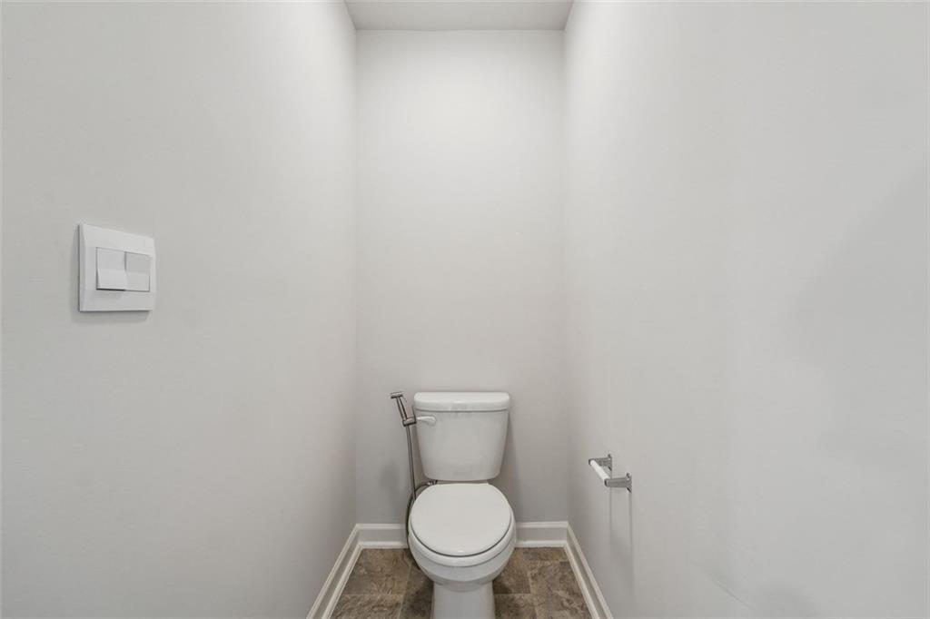 96 Quail Bend Way Dallas, GA 30157 - Photo 23 of 58 a white toilet sitting next to a white wall