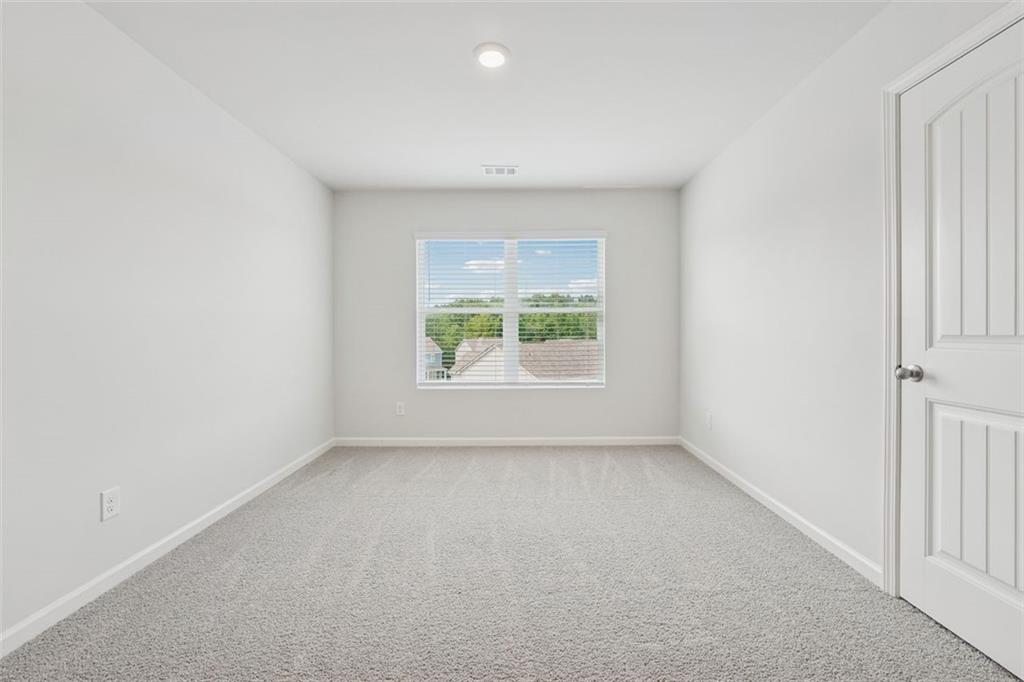 96 Quail Bend Way Dallas, GA 30157 - Photo 27 of 58 an empty room with windows