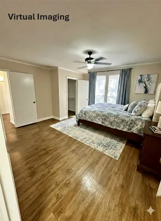 a living room with hard wood floors