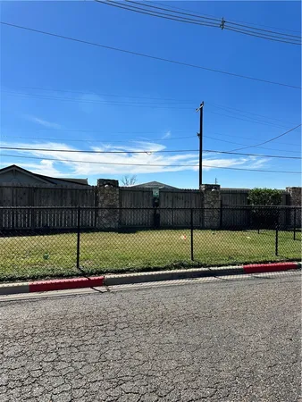 a view of a road with a big yard