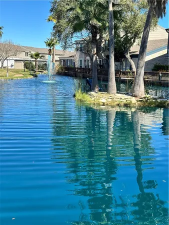 a view of yard with swimming pool and green space
