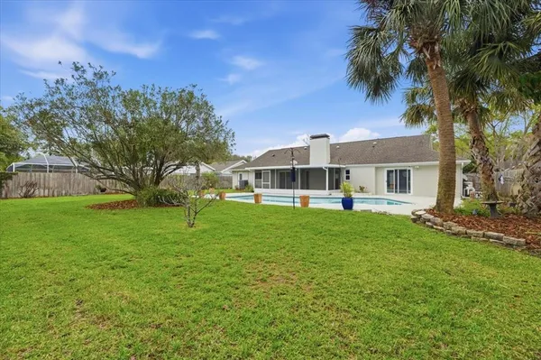a front view of house with yard and green space