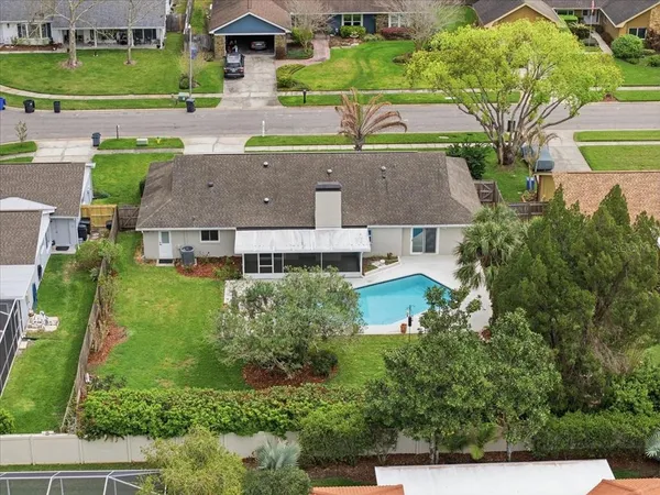 an aerial view of a house with a garden