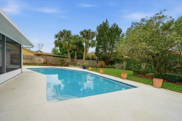 a view of swimming pool with a yard