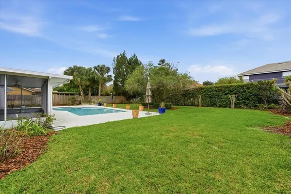 a view of a garden with a house