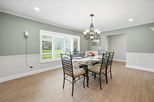 a view of a dining room with furniture and window