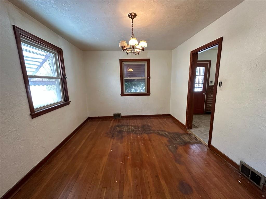 809 St Clair Avenue Clairton, PA 15025 - Photo 7 of 15 wooden floor in an empty room with a window