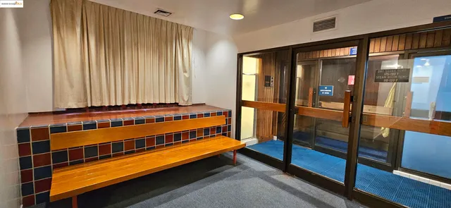 a view of a chairs and table in a yard next to a building