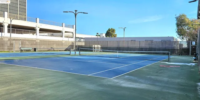 a kitchen with stainless steel appliances a stove a sink and a refrigerator
