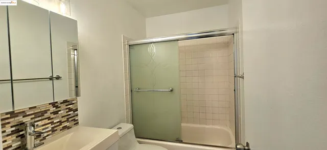 a kitchen with a sink and a white cabinets