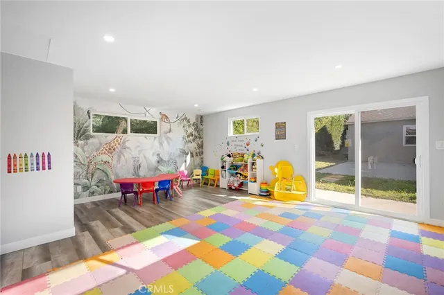 a living room with dining area and a table
