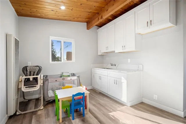 a utility room with sink dryer and washer
