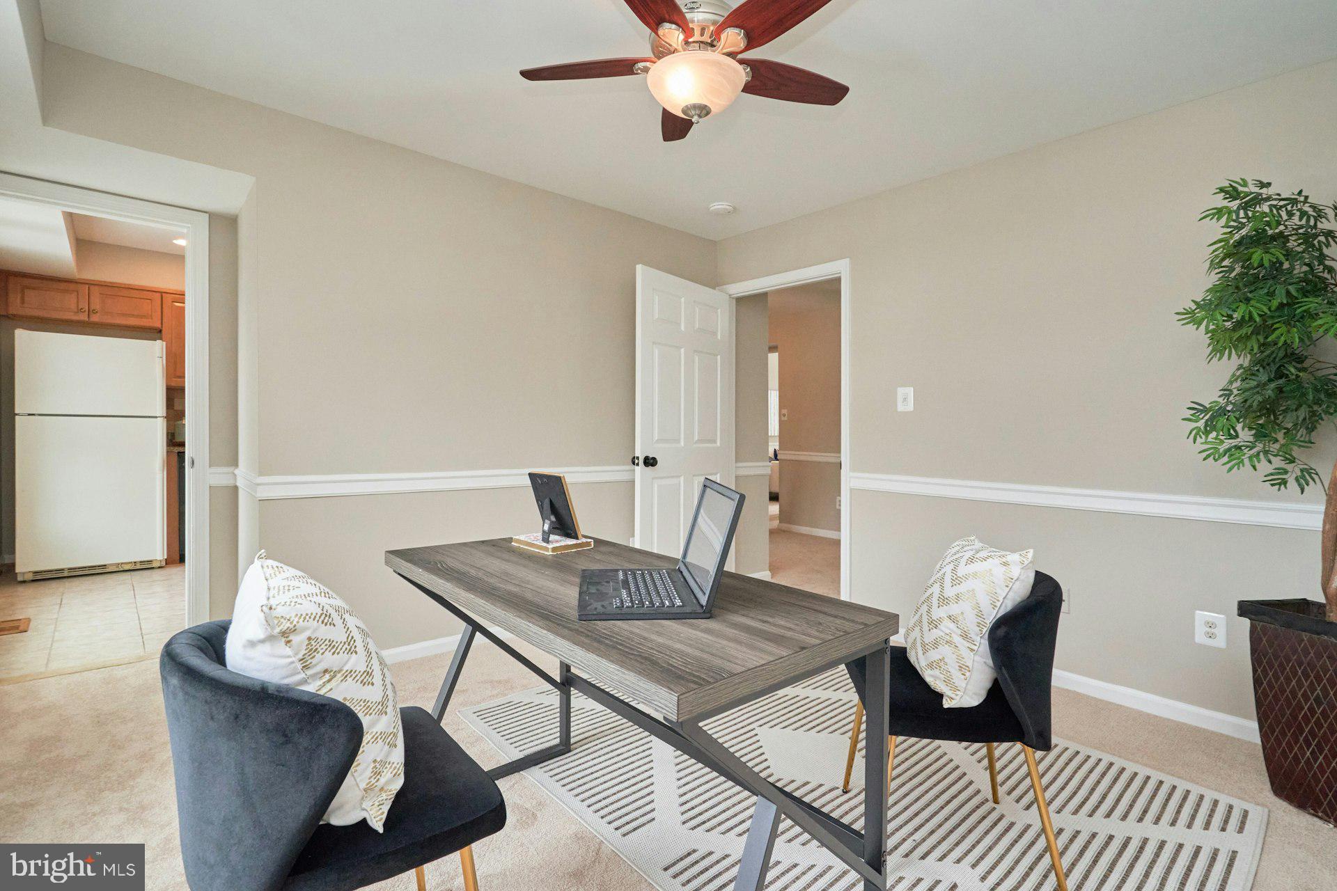 9634 Blincoe Court Burke, VA 22015 - Photo 12 of 53 a view of a dining room with furniture and wooden floor