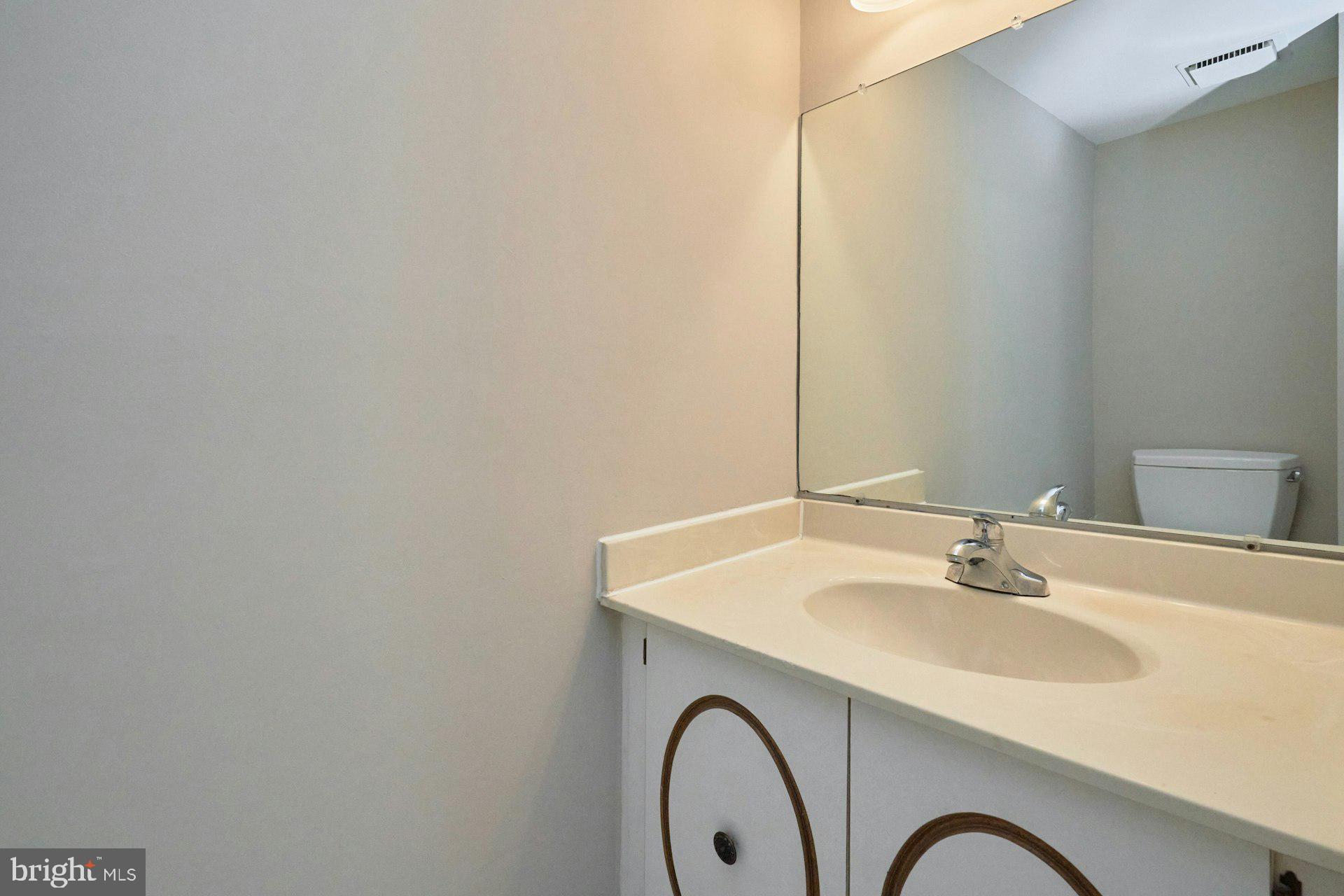 9634 Blincoe Court Burke, VA 22015 - Photo 17 of 53 a bathroom with a sink and a mirror