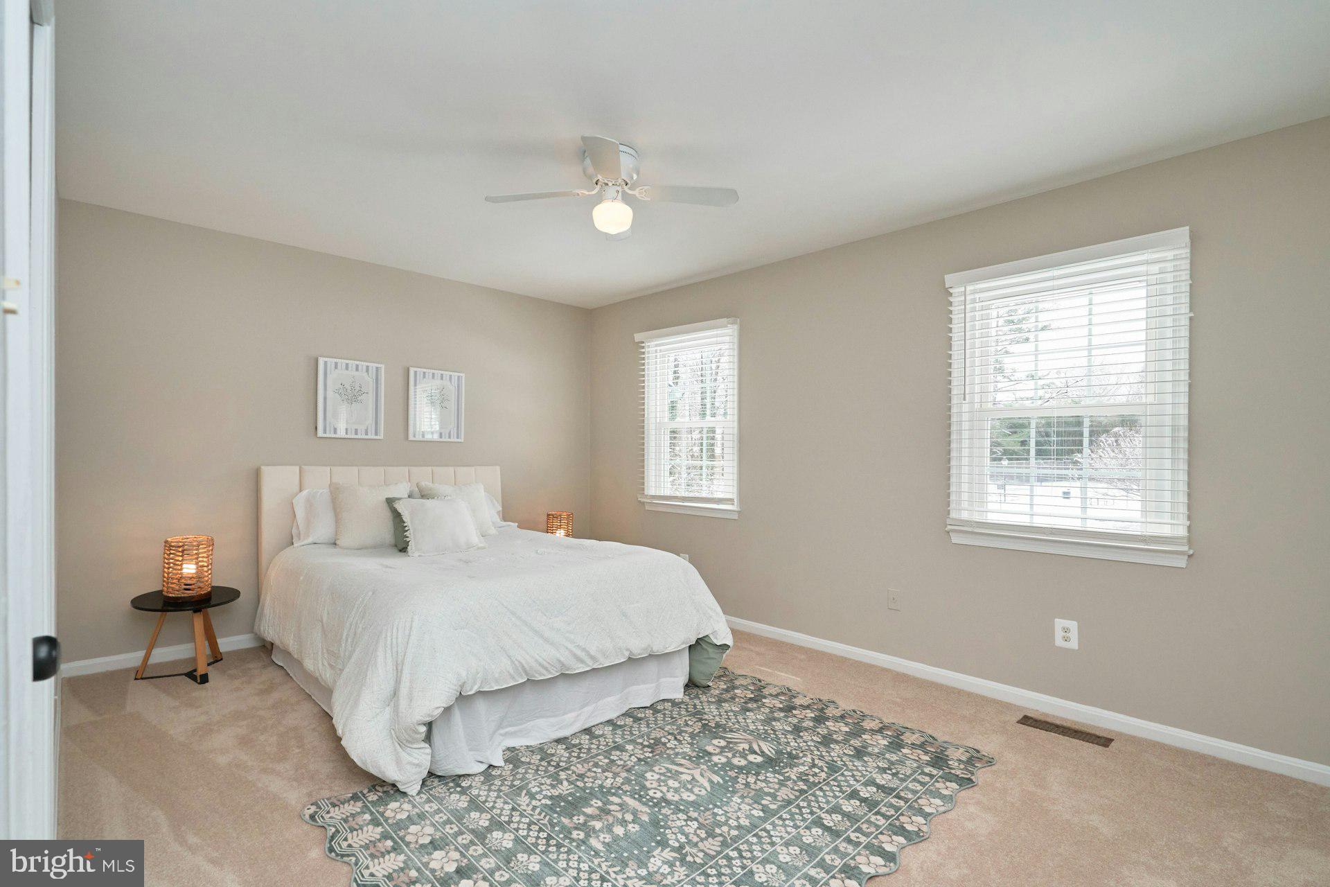 9634 Blincoe Court Burke, VA 22015 - Photo 18 of 53 a bedroom with a large bed and a window