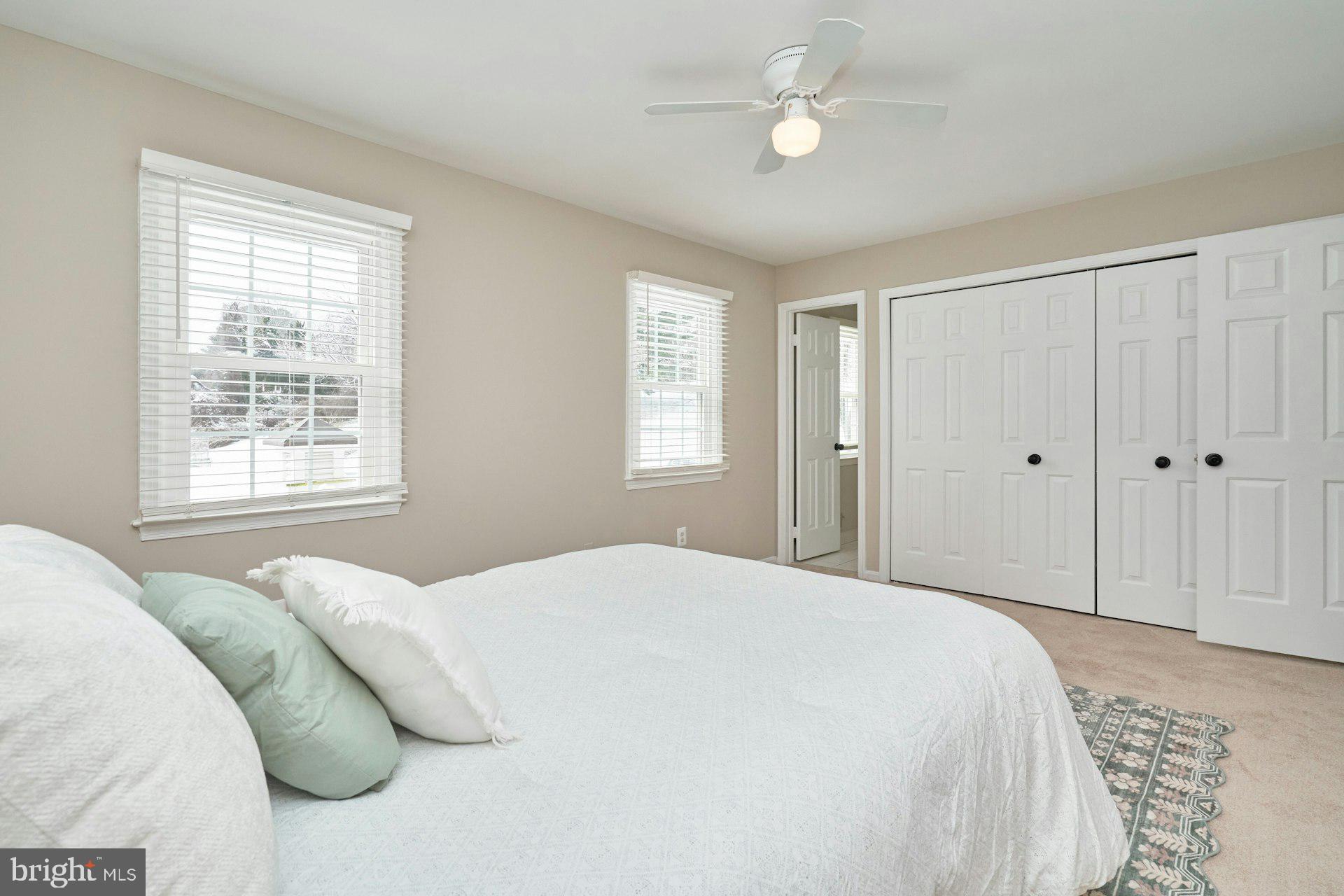 9634 Blincoe Court Burke, VA 22015 - Photo 20 of 53 a bedroom with a bed cabinet and a window