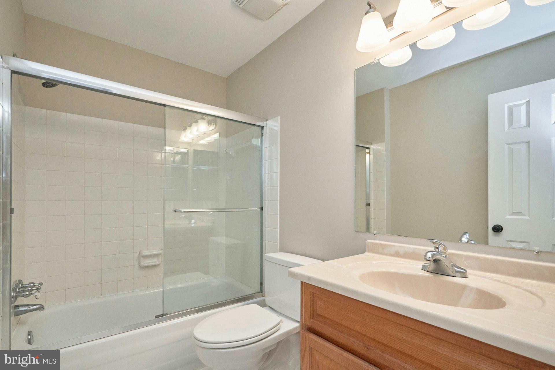 9634 Blincoe Court Burke, VA 22015 - Photo 25 of 53 a bathroom with a sink a toilet and shower