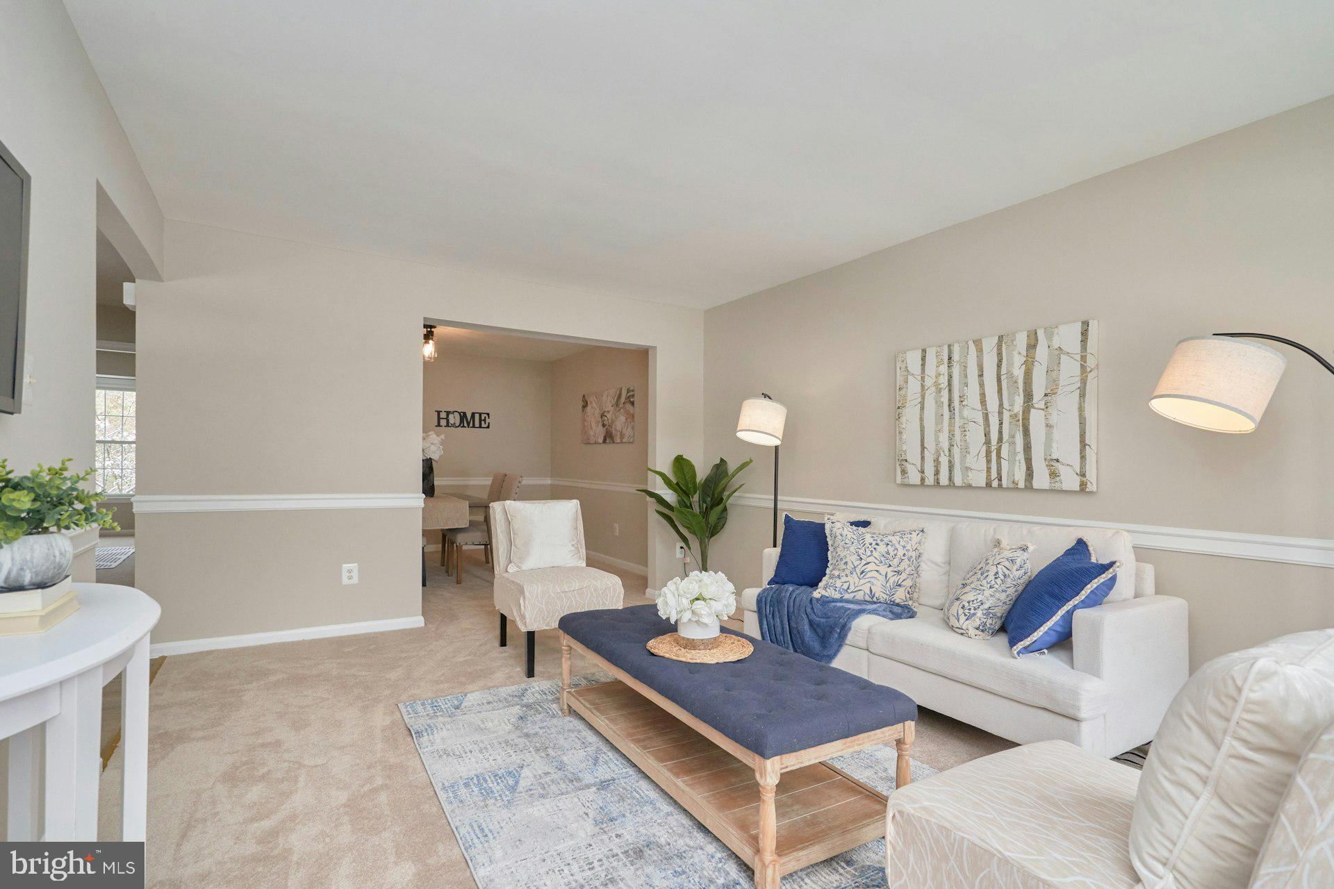 9634 Blincoe Court Burke, VA 22015 - Photo 5 of 53 a living room with furniture and a potted plant