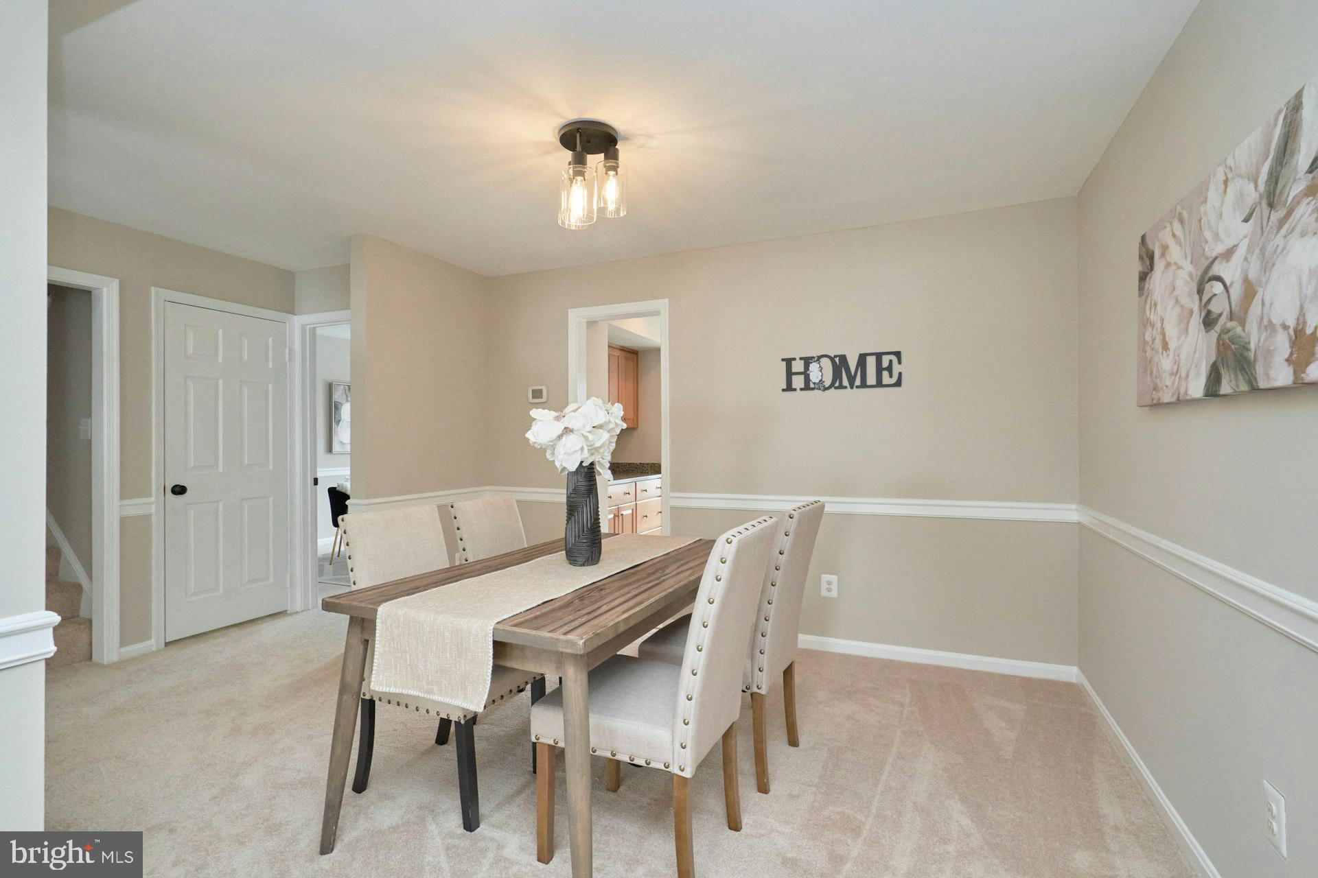 9634 Blincoe Court Burke, VA 22015 - Photo 7 of 53 a dining room with furniture and wooden floor