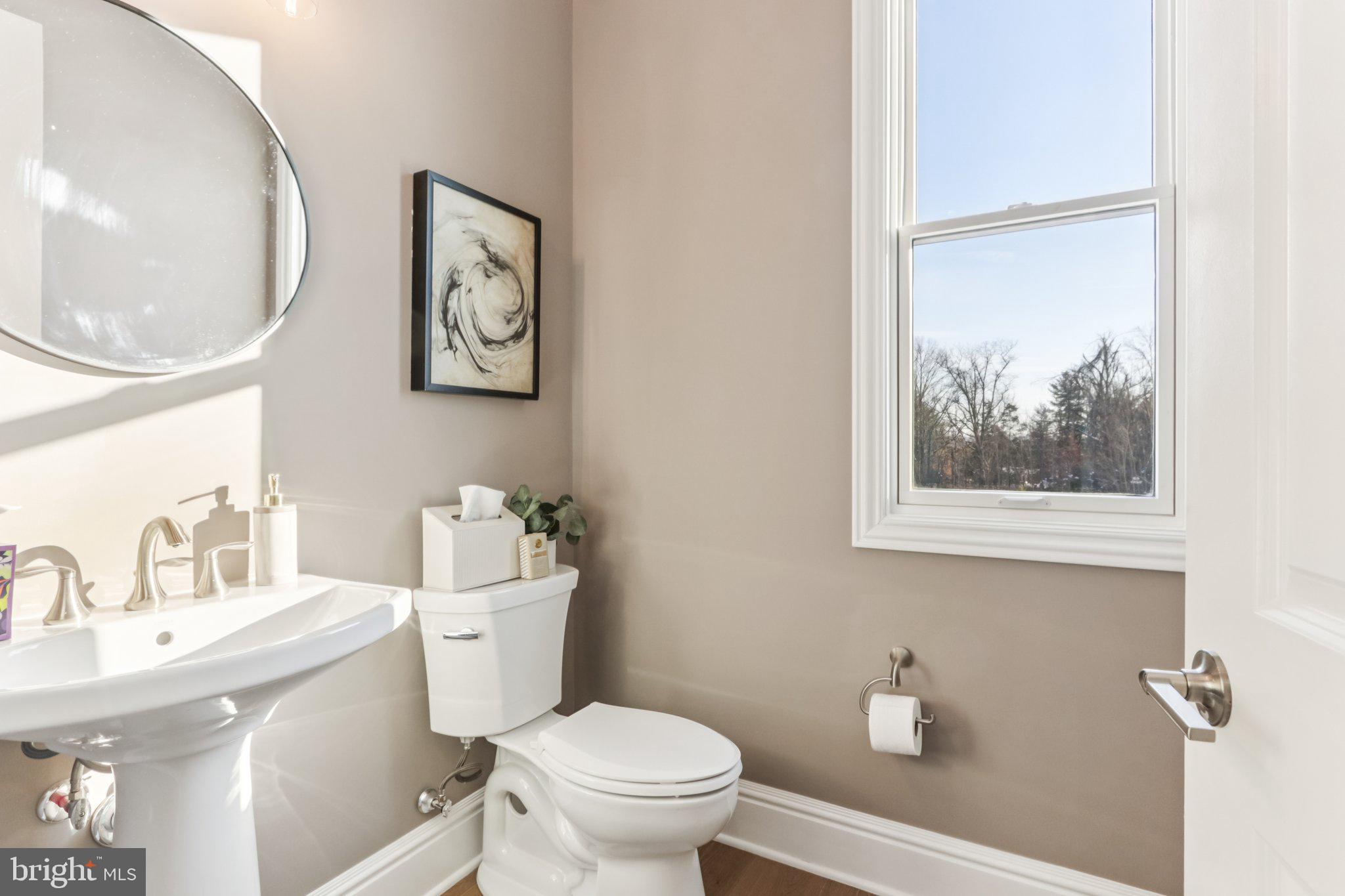 510 Newcomen Road, Unit B3D Exton, PA 19341 - Photo 40 of 74 a bathroom with a toilet a sink and a mirror