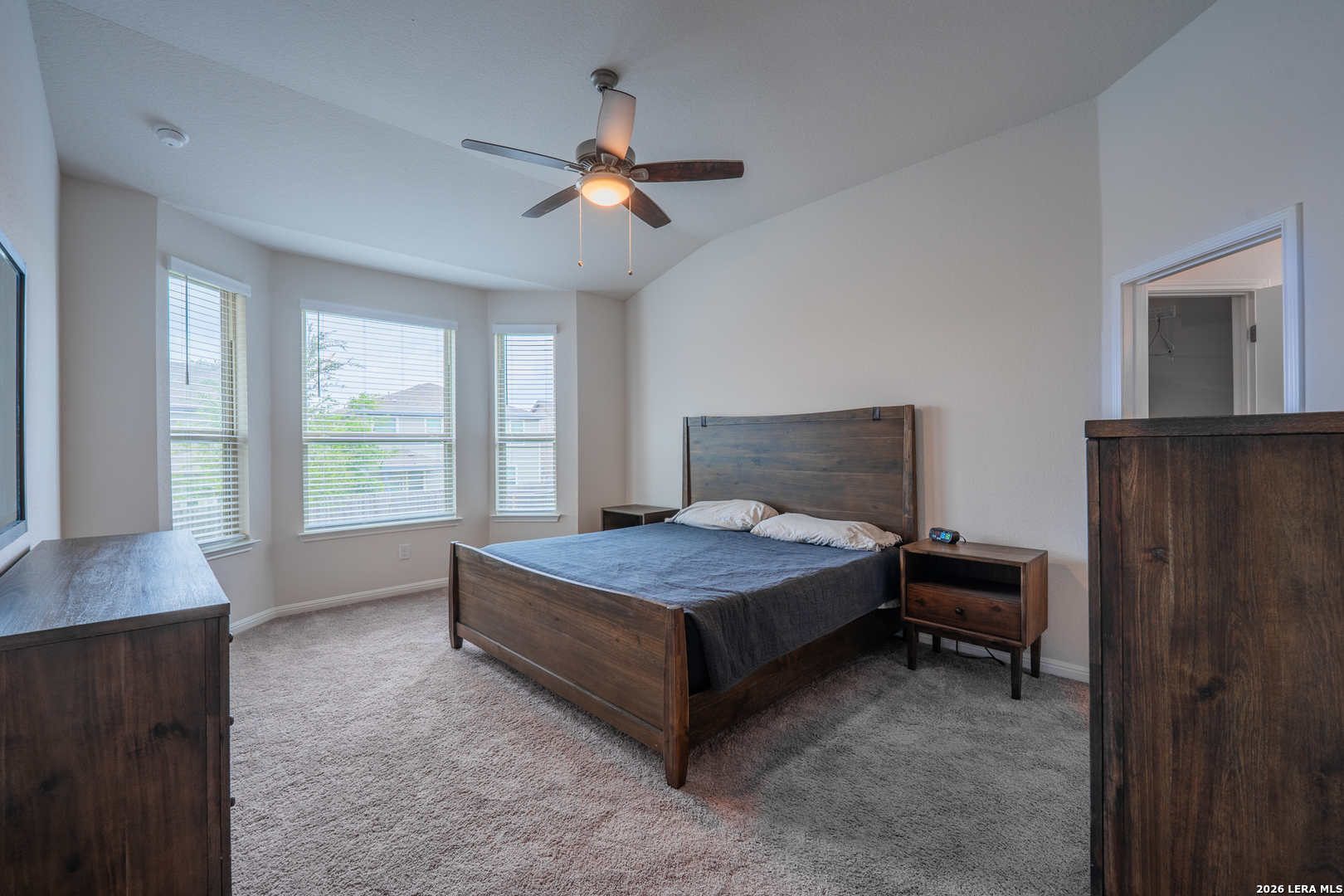 4947 Ranahan Pass St. Hedwig, TX 78152 - Photo 15 of 37 a bedroom with a bed and a window