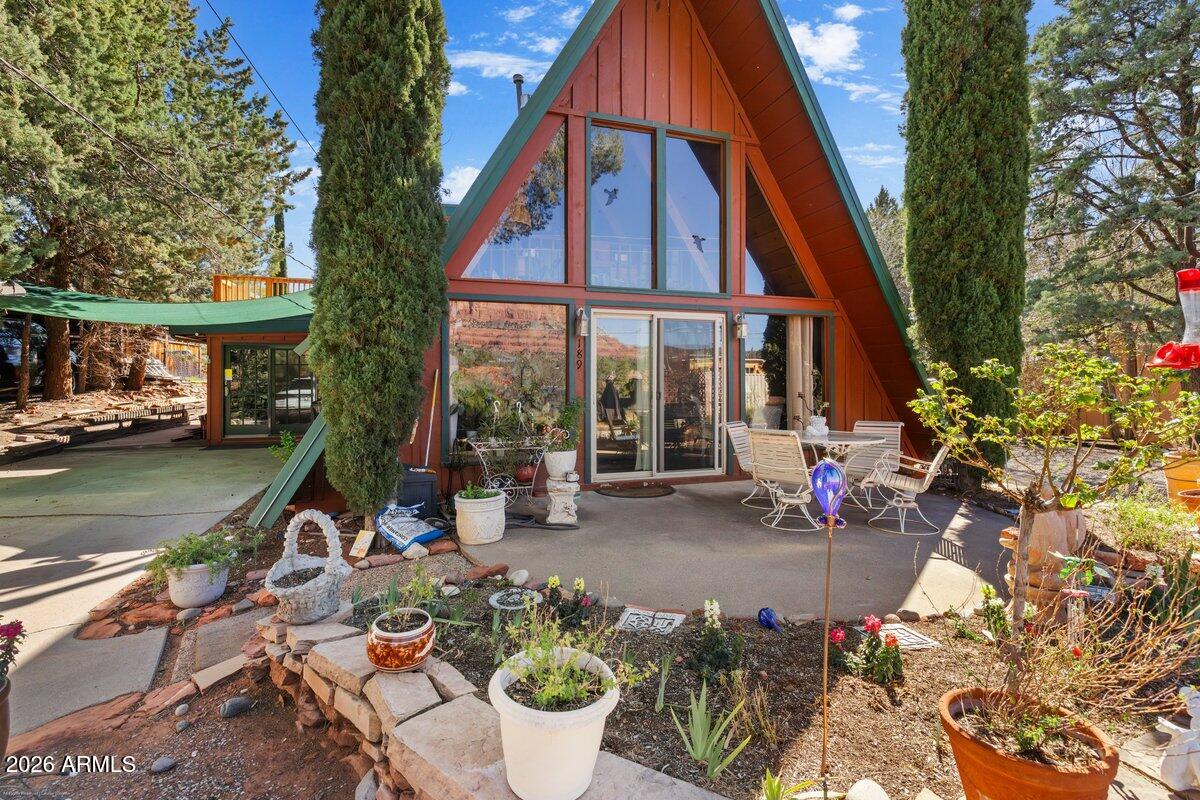 189 Wilson Canyon Road Sedona, AZ 86336 - Photo 2 of 47 a group of people sitting in front of a house
