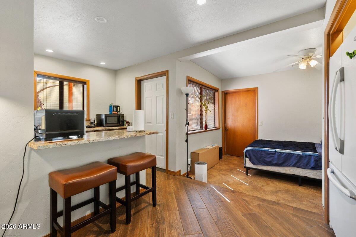 189 Wilson Canyon Road Sedona, AZ 86336 - Photo 25 of 47 a living room with furniture and a flat screen tv
