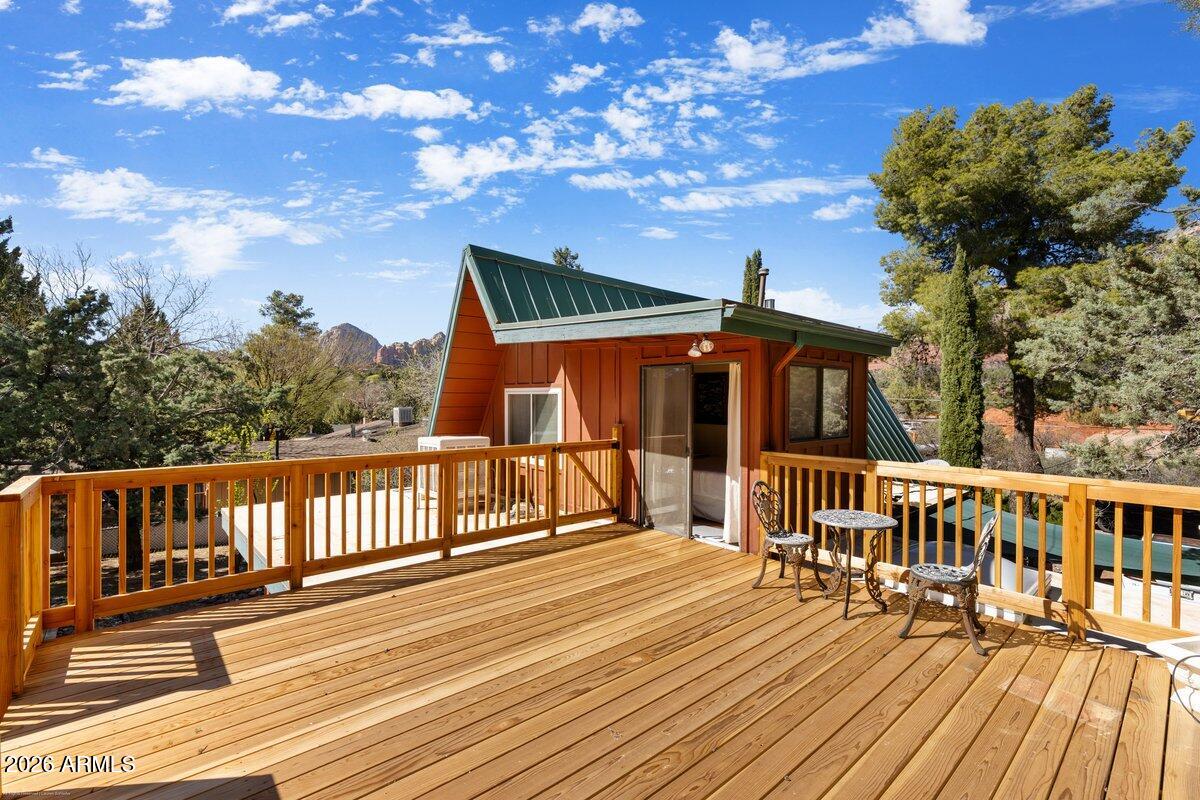 189 Wilson Canyon Road Sedona, AZ 86336 - Photo 32 of 47 a view of a house with wooden deck