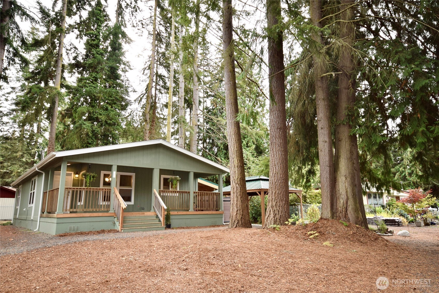 375 Dungeness Meadows Sequim, WA 98382 - Photo 2 of 27 a front view of a house with a garden