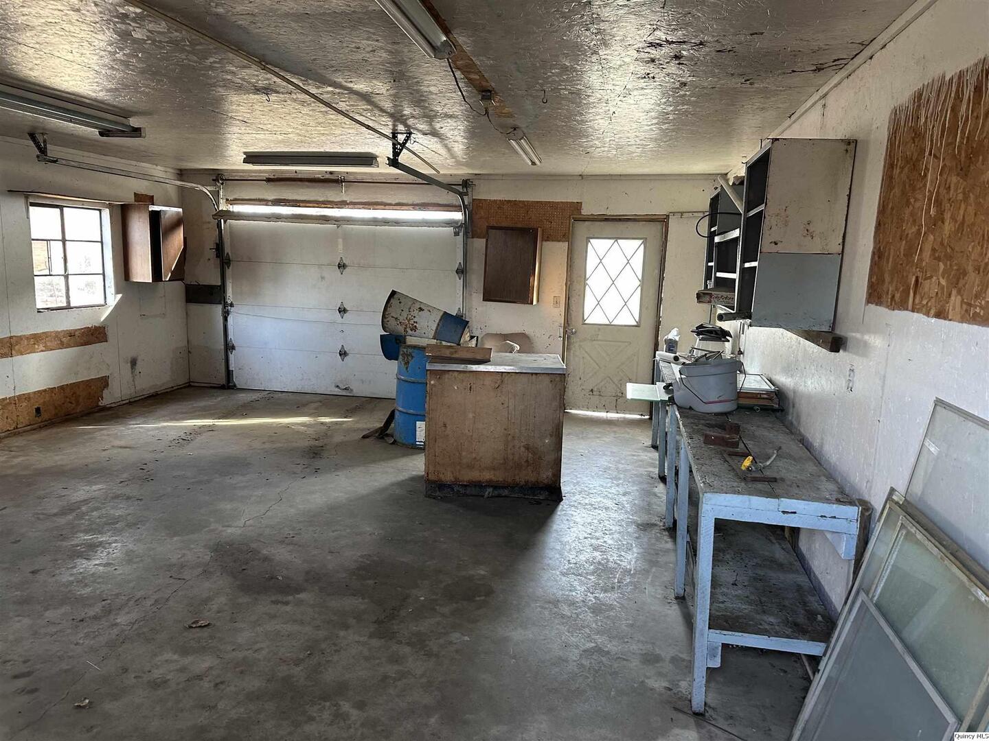 404 West State Street Camp Point, IL 62320 - Photo 2 of 3 a living room with furniture and a fireplace