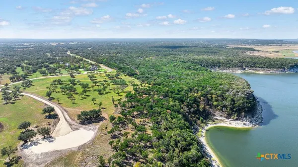 a view of a lake with a yard
