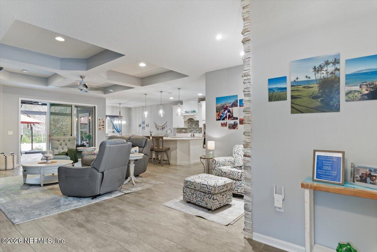 96085 Breezeway Court Yulee, FL 32097 - Photo 12 of 59 a living room with furniture and a table
