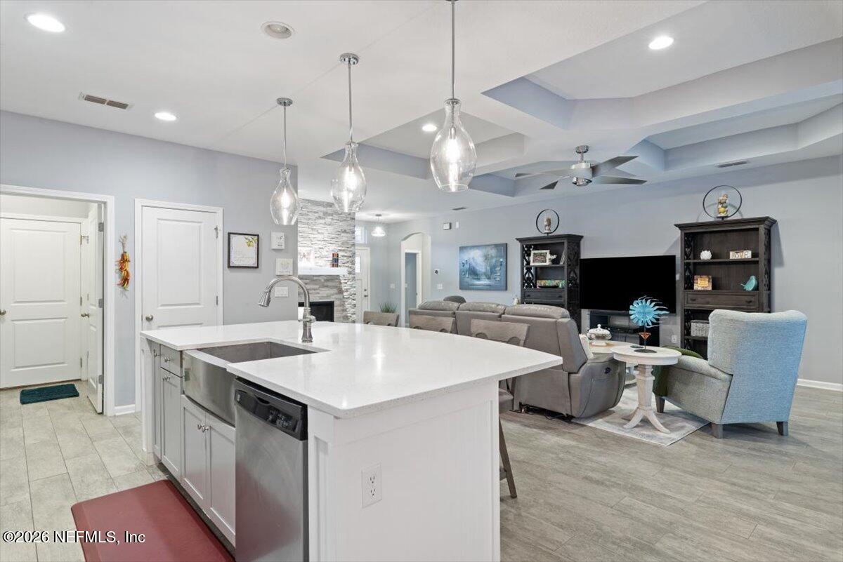96085 Breezeway Court Yulee, FL 32097 - Photo 19 of 59 a view of kitchen and living room
