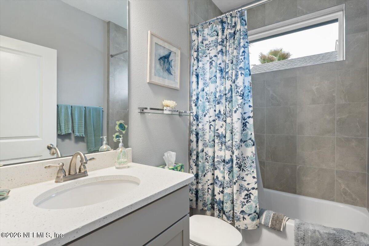 96085 Breezeway Court Yulee, FL 32097 - Photo 33 of 59 a bathroom with a sink toilet and shower