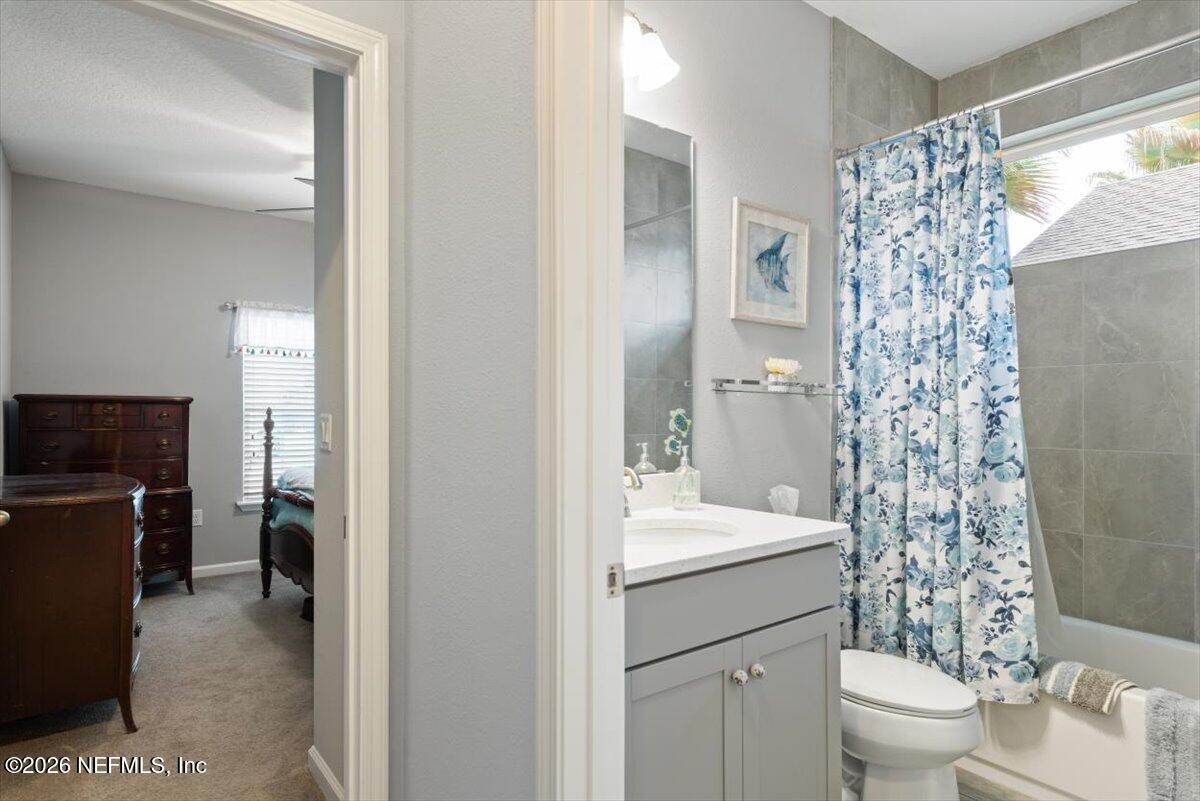 96085 Breezeway Court Yulee, FL 32097 - Photo 34 of 59 a bathroom with a sink toilet and shower