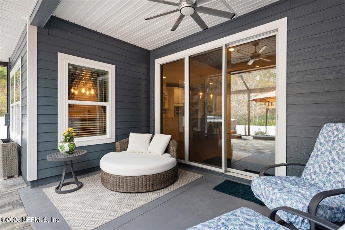 96085 Breezeway Court Yulee, FL 32097 - Photo 39 of 59 a living room with furniture and a window