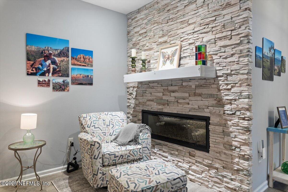 96085 Breezeway Court Yulee, FL 32097 - Photo 4 of 59 a living room with furniture and a fireplace