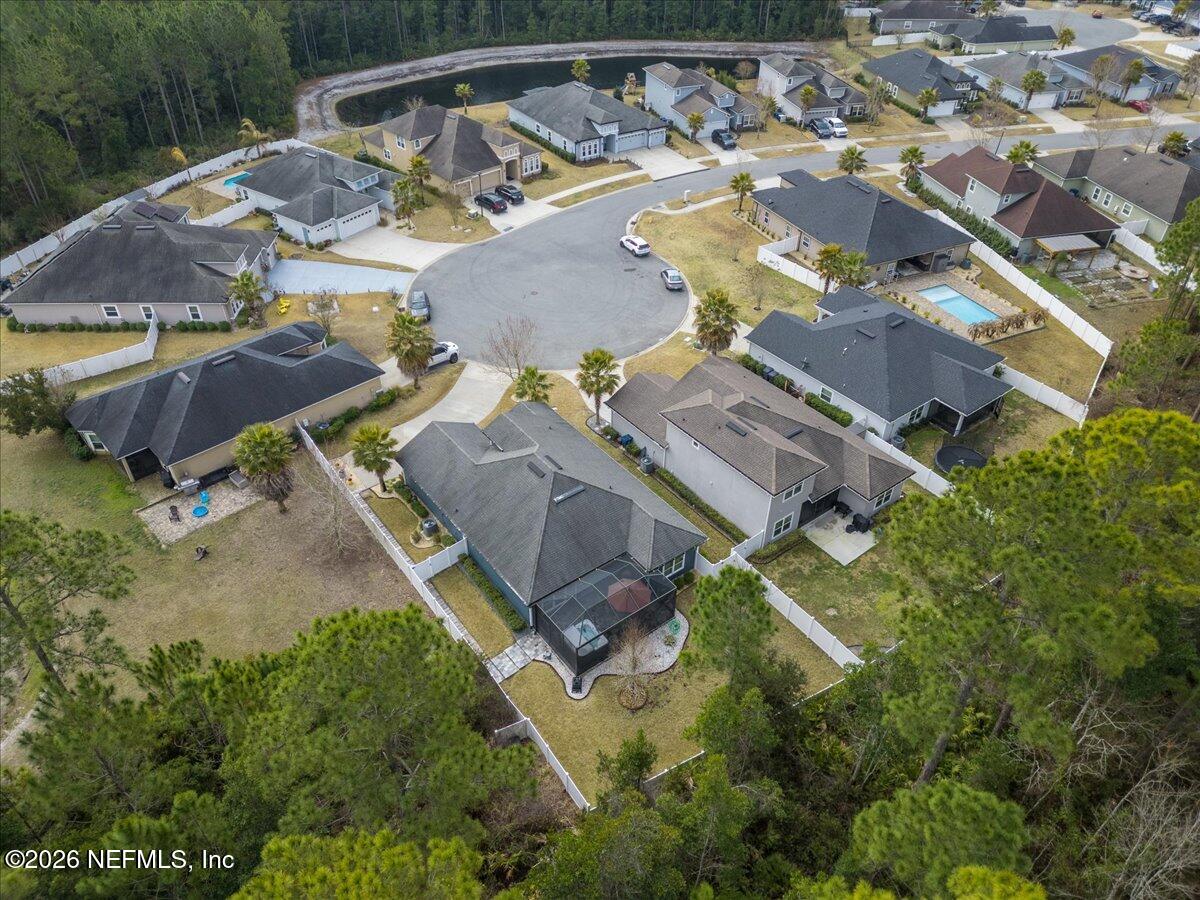 96085 Breezeway Court Yulee, FL 32097 - Photo 59 of 59 an aerial view of a house with outdoor space