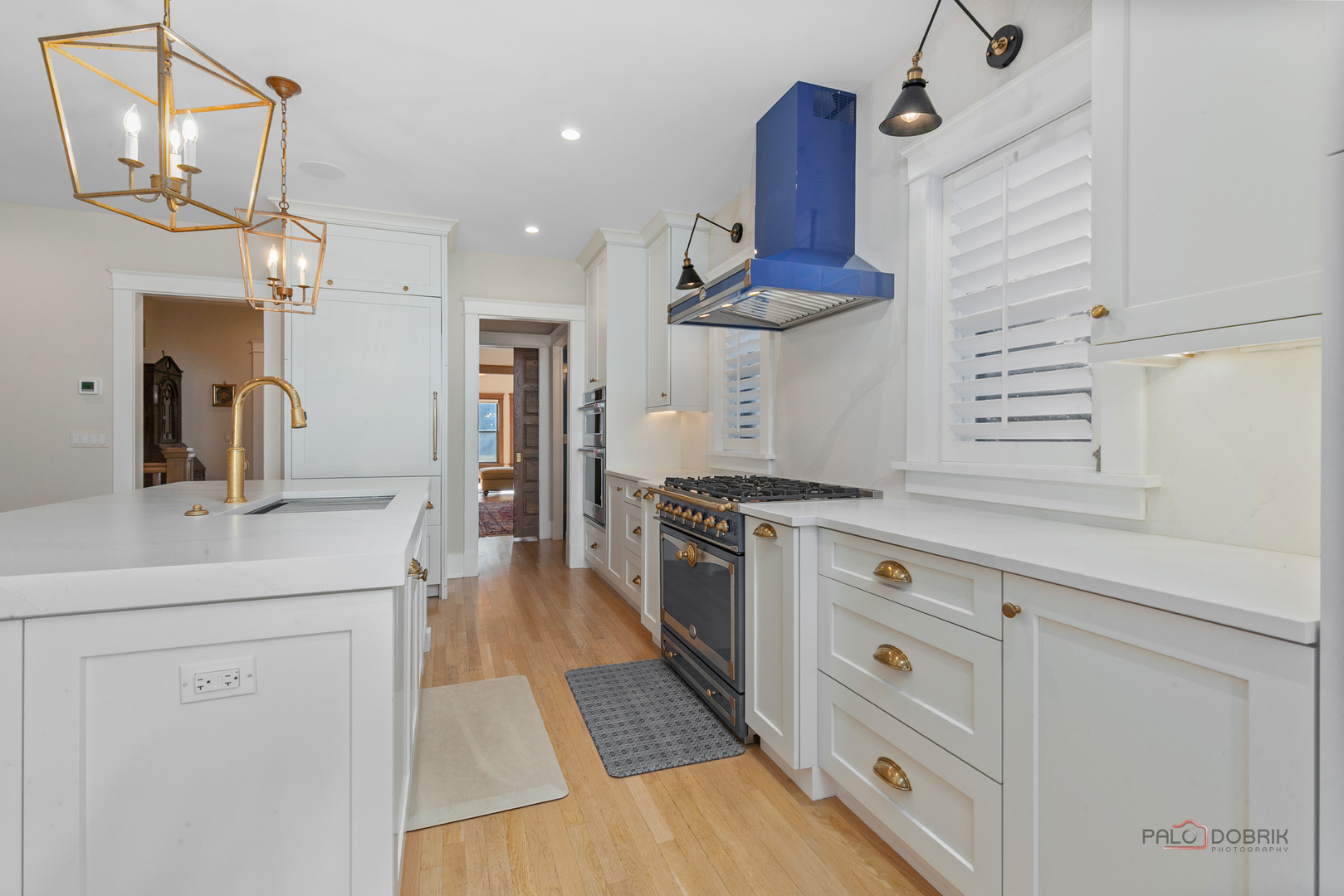 90 East Woodland Road Lake Forest, IL 60045 - Photo 14 of 40 a kitchen with stainless steel appliances granite countertop a sink a stove and a refrigerator