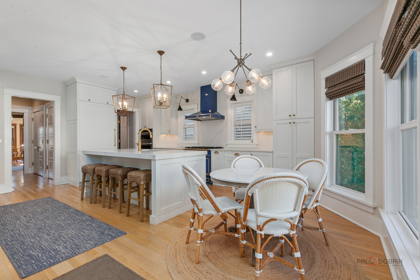 90 East Woodland Road Lake Forest, IL 60045 - Photo 15 of 40 a view of a dining room with furniture window and wooden floor