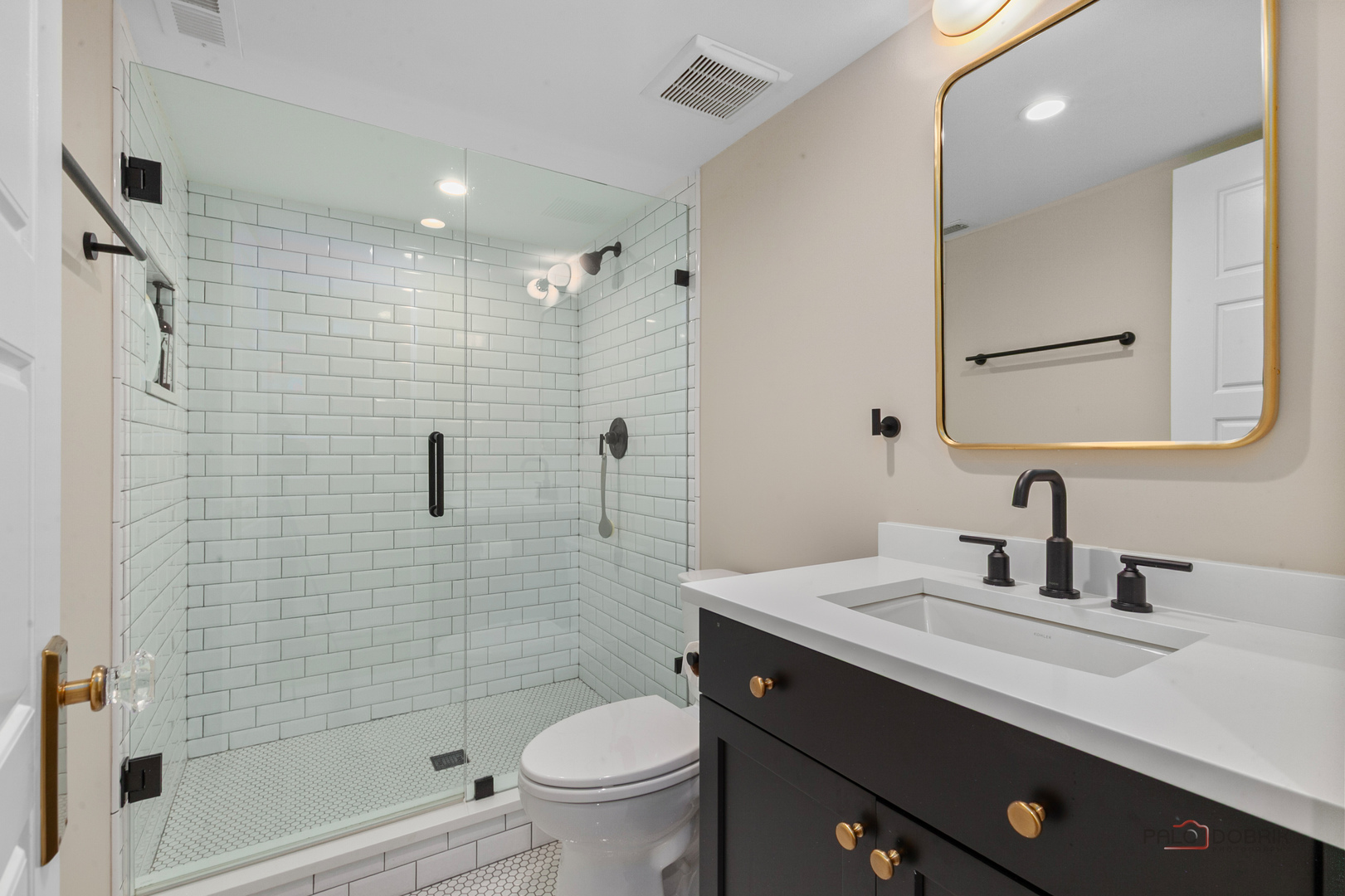 90 East Woodland Road Lake Forest, IL 60045 - Photo 35 of 40 a bathroom with a sink a toilet and shower