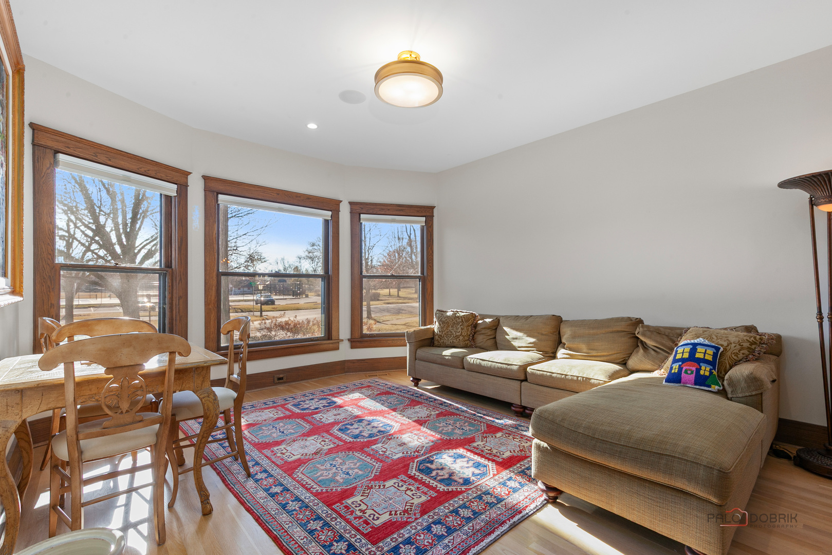 90 East Woodland Road Lake Forest, IL 60045 - Photo 9 of 40 a living room with furniture and a floor to ceiling window