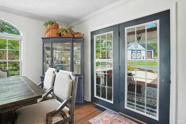 a kitchen with kitchen island granite countertop a sink stainless steel appliances and cabinets