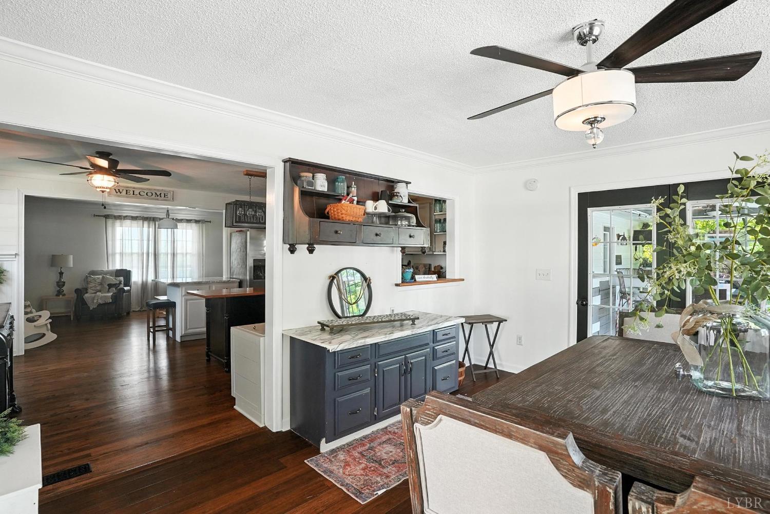 1348 Salem Road Spout Spring, VA 24593 - Photo 16 of 89 a living room with furniture and a clock