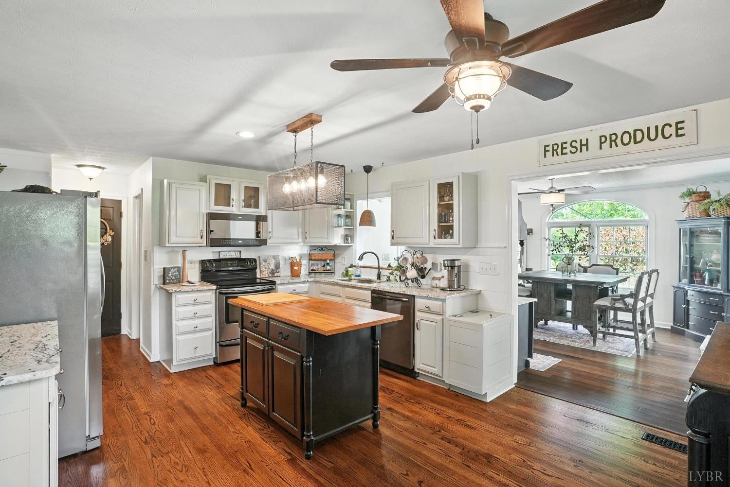 1348 Salem Road Spout Spring, VA 24593 - Photo 18 of 89 a kitchen with stainless steel appliances granite countertop a refrigerator a sink dishwasher a stove and white countertops with wooden floor