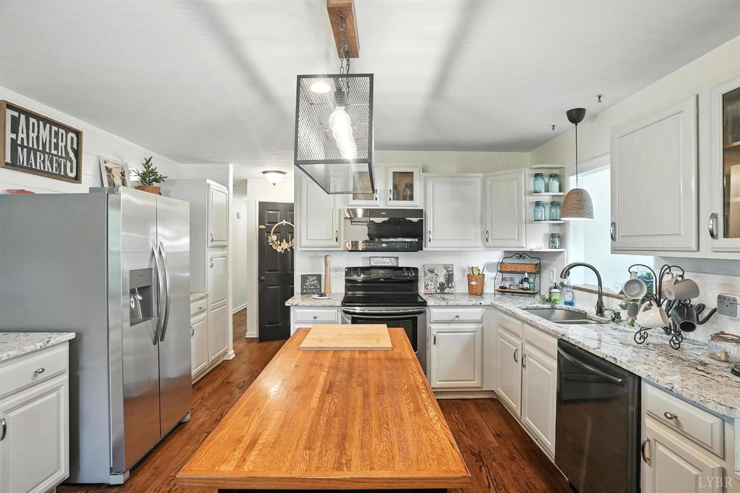 1348 Salem Road Spout Spring, VA 24593 - Photo 19 of 89 a kitchen with refrigerator a sink and cabinets