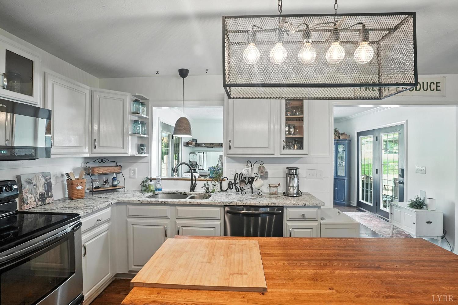 1348 Salem Road Spout Spring, VA 24593 - Photo 20 of 89 a kitchen with kitchen island granite countertop a sink stainless steel appliances and cabinets