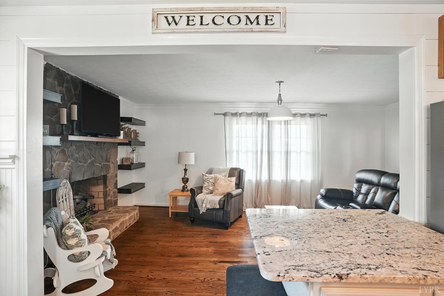 1348 Salem Road Spout Spring, VA 24593 - Photo 23 of 89 a living room with furniture and a fireplace